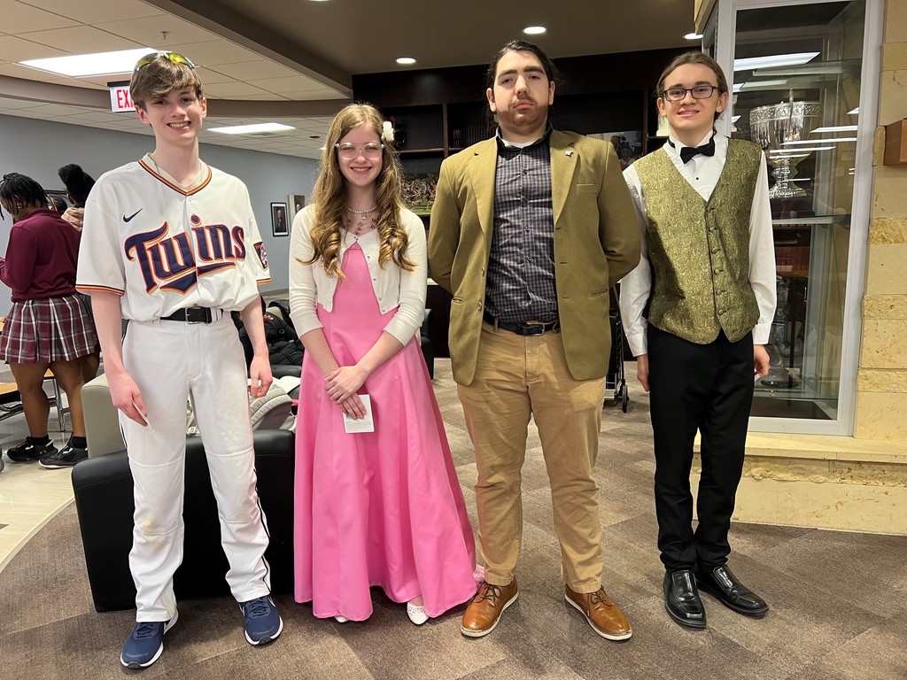 student in a dress and student dressed as a teacher