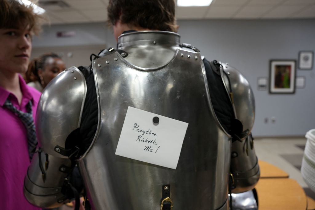 suit of armor with prank sign