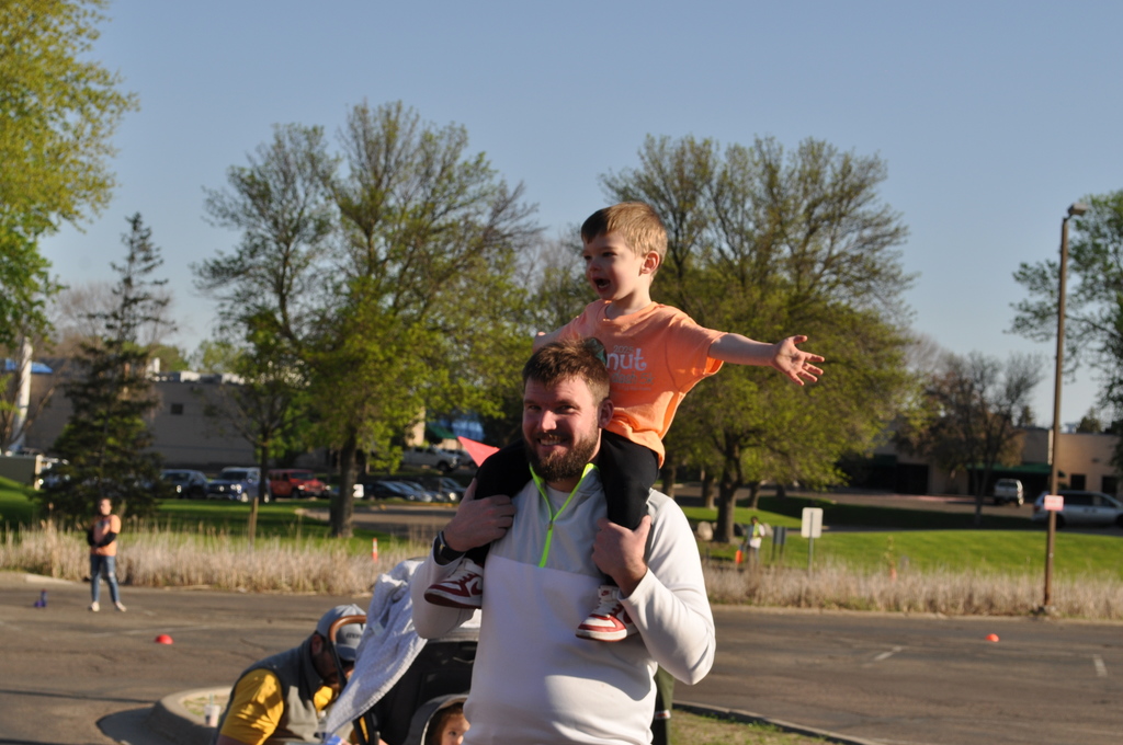 son on dad's shoulders