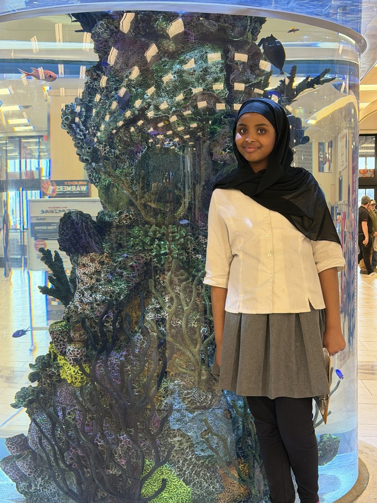 student by fish tank
