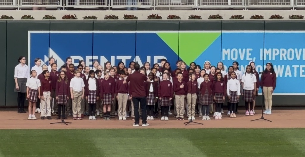 students singing at Target Field