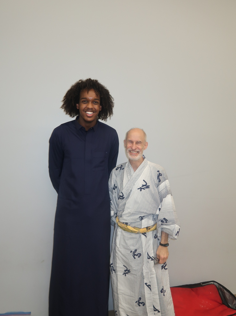 student and teacher in cultural wear