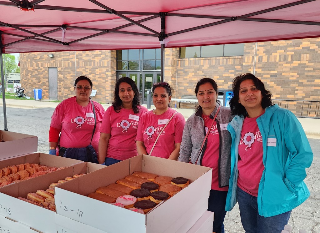 volunteers with donuts