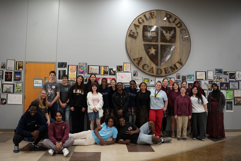 students in front of artwork