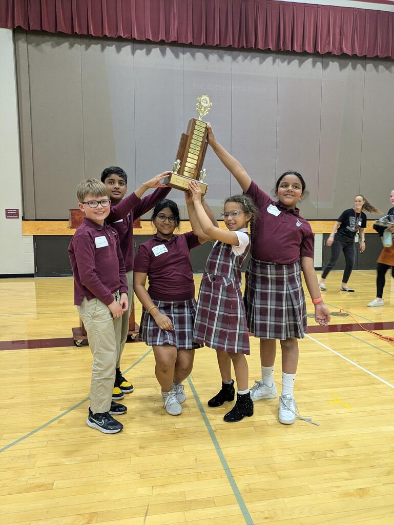 book battlers holding trophy