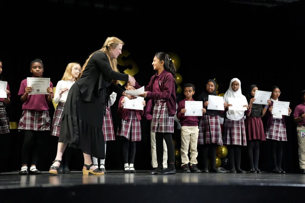student receiving certificate