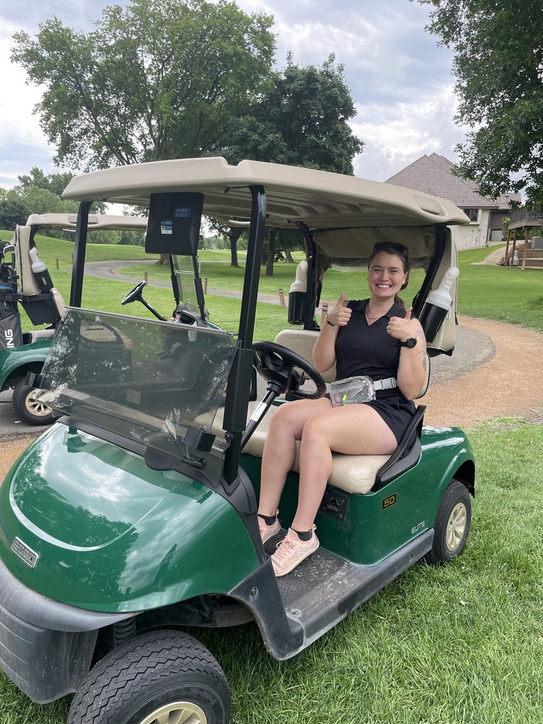 riley in golf cart