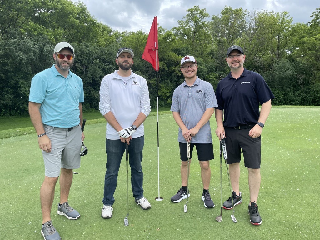 staff members golfing