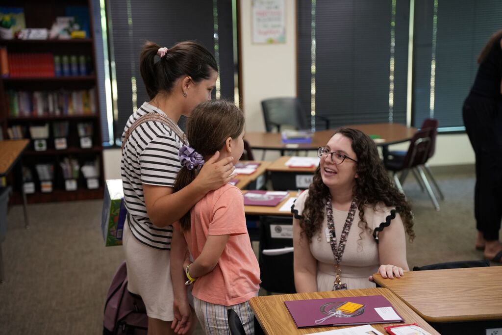 student with teacher