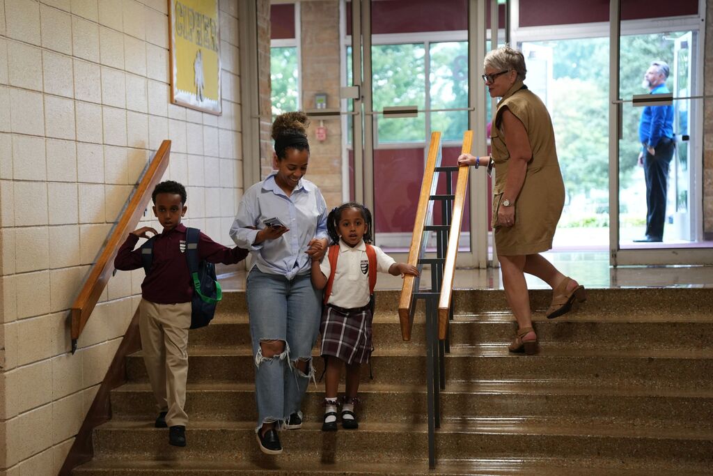 family walking down stairs