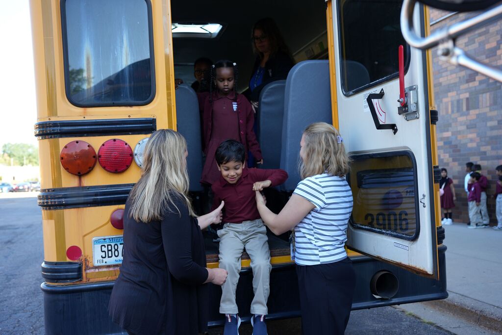 student leaving bus