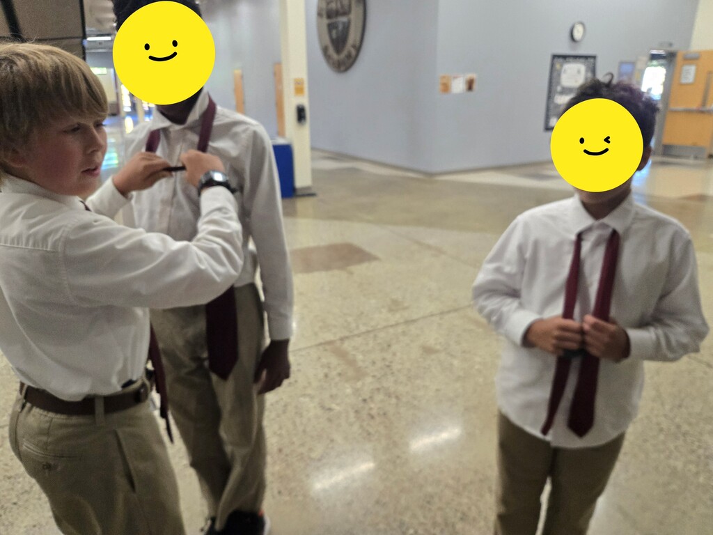 student tying ties