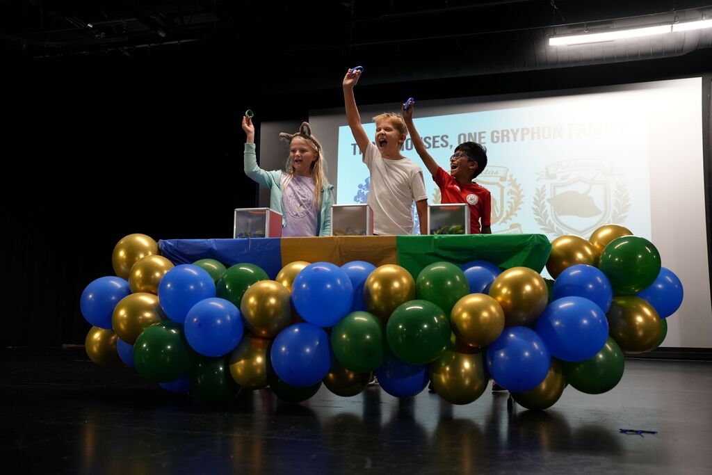 students excited pulling out wristband