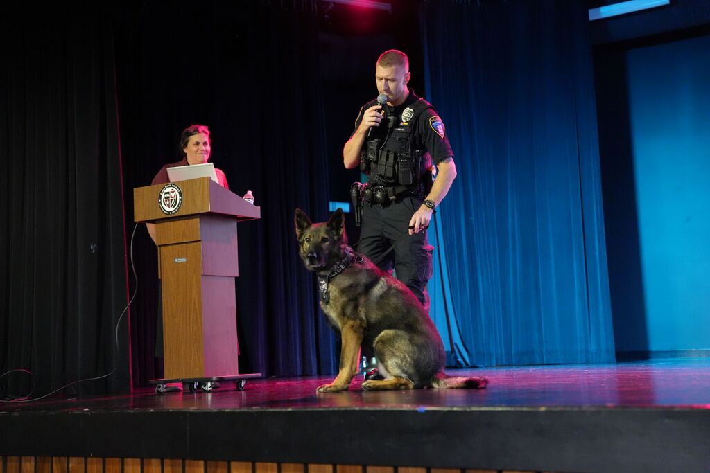 cop speaking with k9 