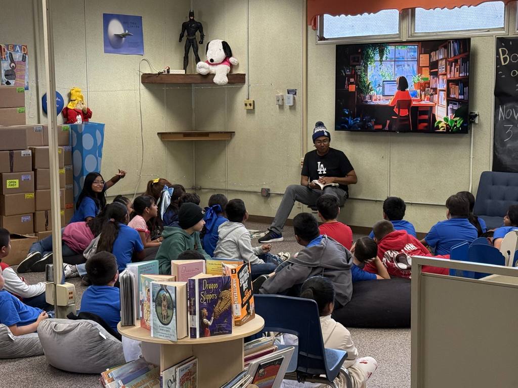 library teacher reading to students
