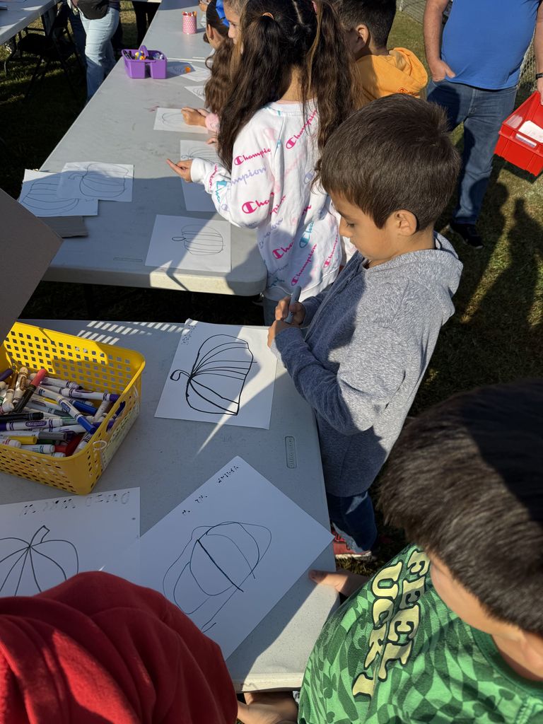 students drawing a pumpkin