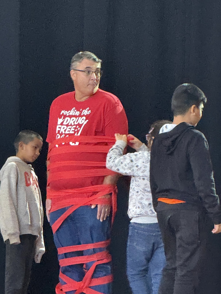 teacher wrapped in red string