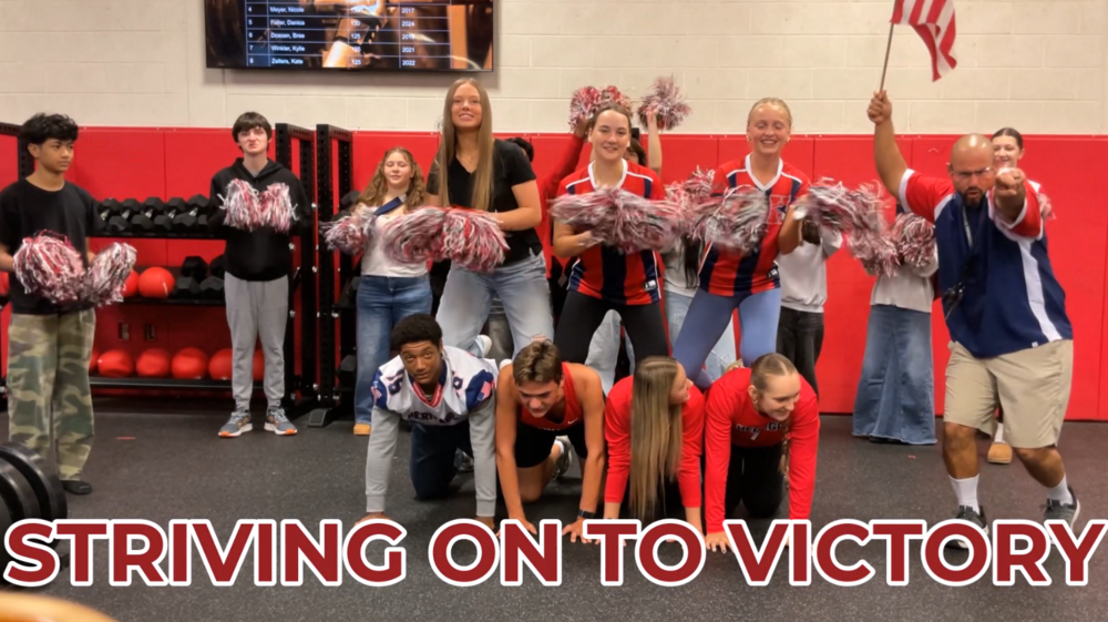 The picture shows Mr. Tigulis' Pat Time class cheering and singing as they performed the school song.