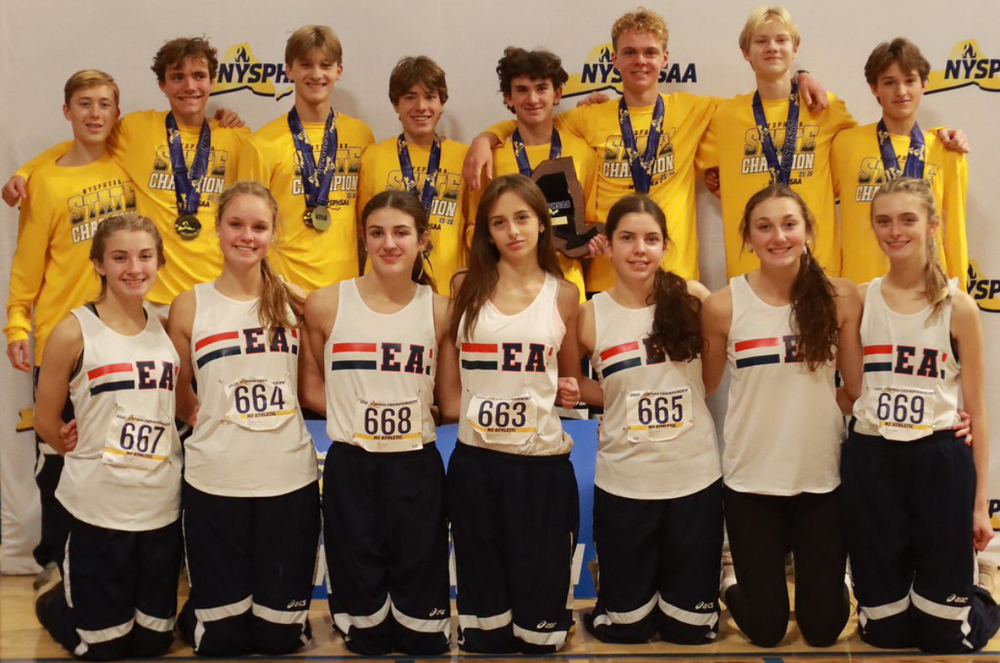 boys and girls track members pose for a picture