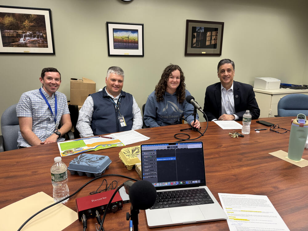 ethan hansen, jeffrey shelley, maya reynolds, and brian russ sitting at the podcast table