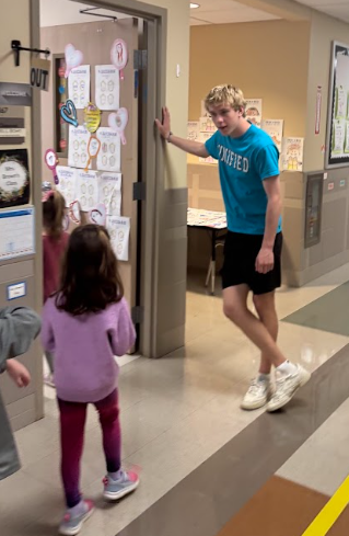 unified team member greeting parkdale students at the door