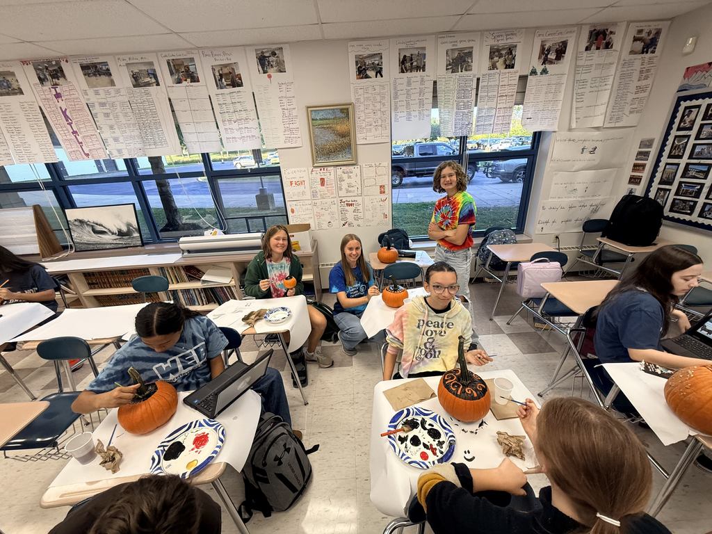 students designing pumpkins