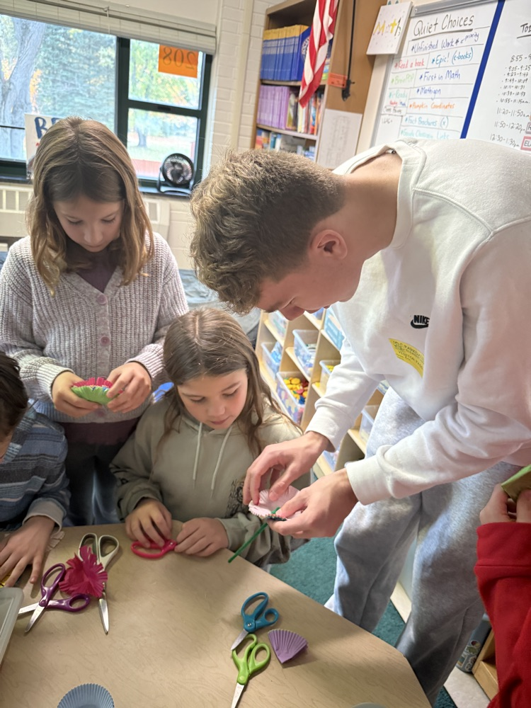 Making traditional Mexican flowers or “cempasuchiles”.