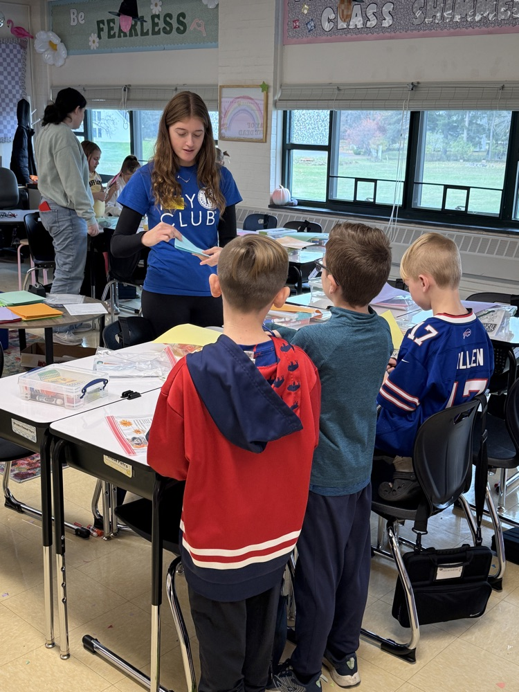 Making “papel picado”, cut decorative papers.