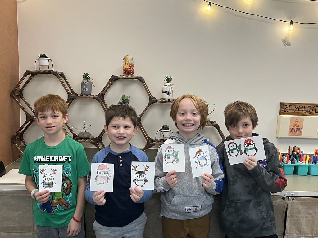 students holding christmas cards