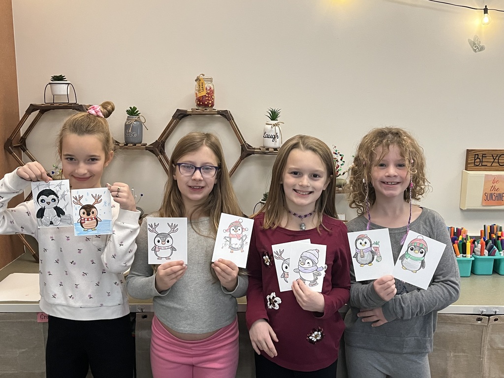 students holding christmas cards