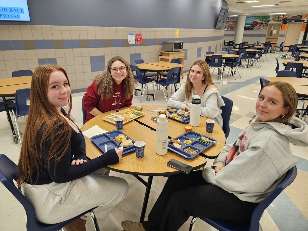 students at the table enjoying their meal