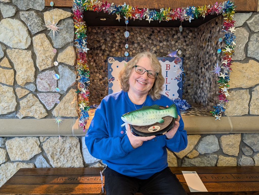 Mrs. Todaro holds the Billy Bass trophy at Parkdale