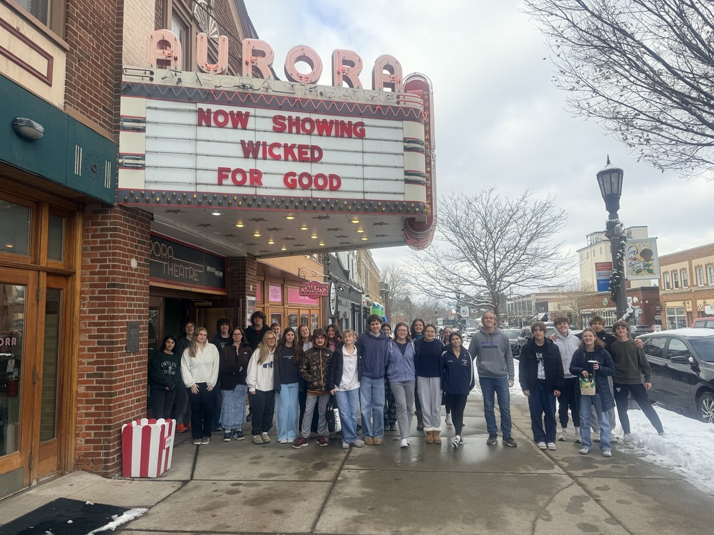 students standing outside the aurora theatre