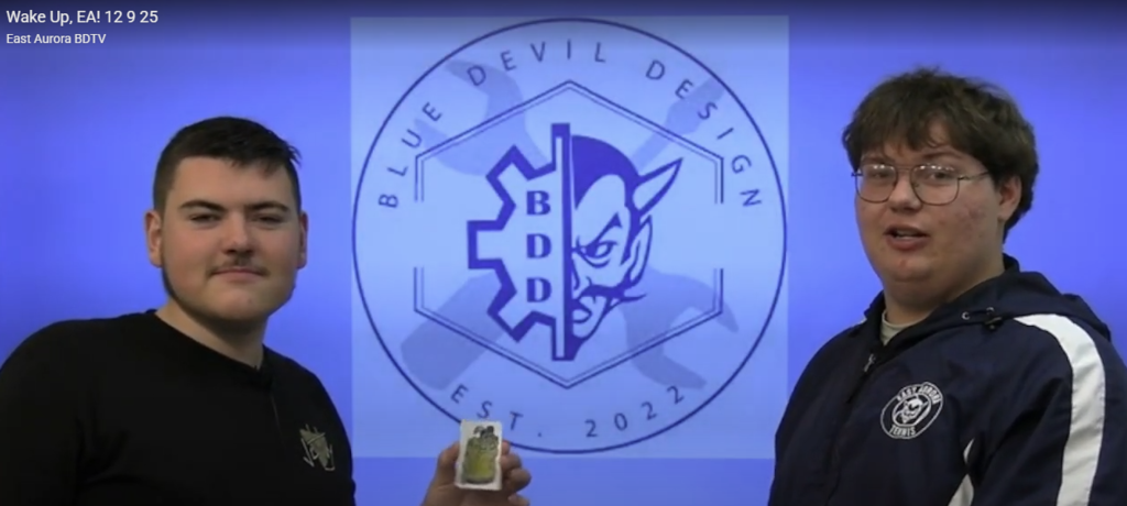 two students in the broadcasting booth for morning announcements