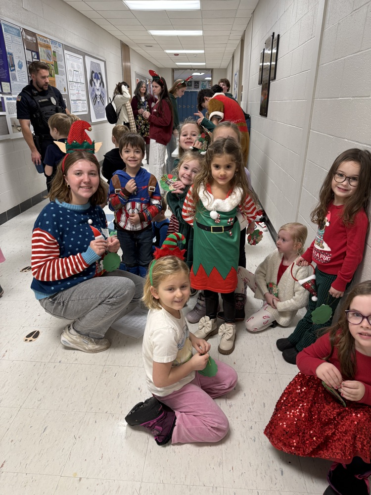 Showing off their decorated ornaments.