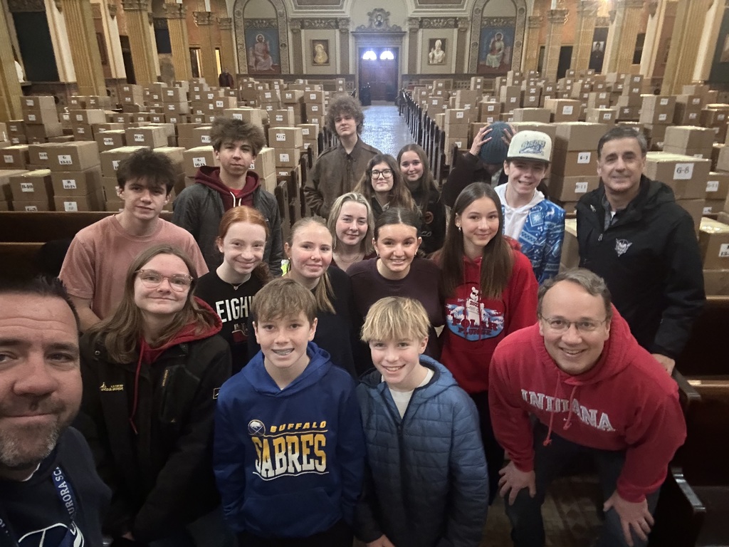 students and admins volunteering at st lukes