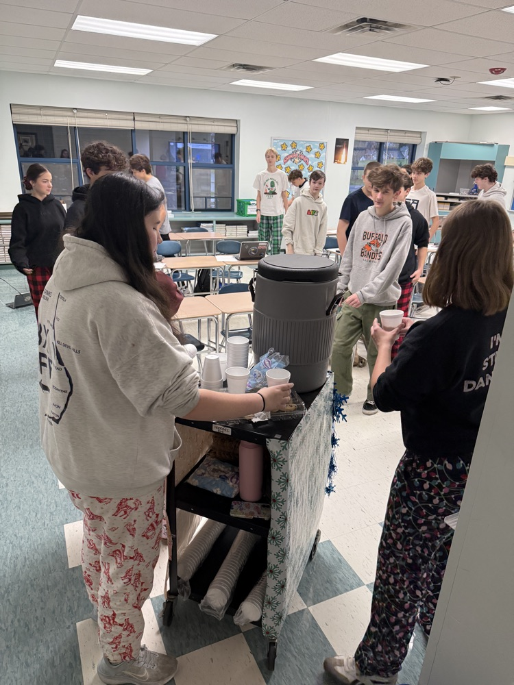 HS students delivering hot cocoa.