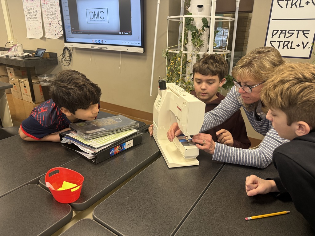 students learning sewing