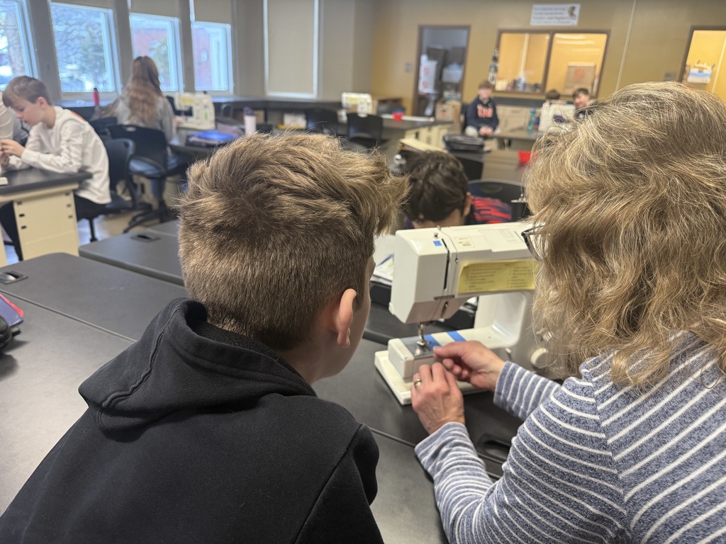 students learning sewing