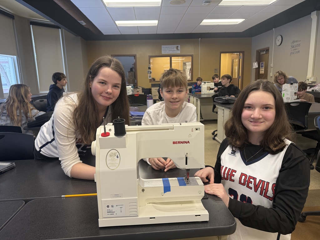 students learning sewing