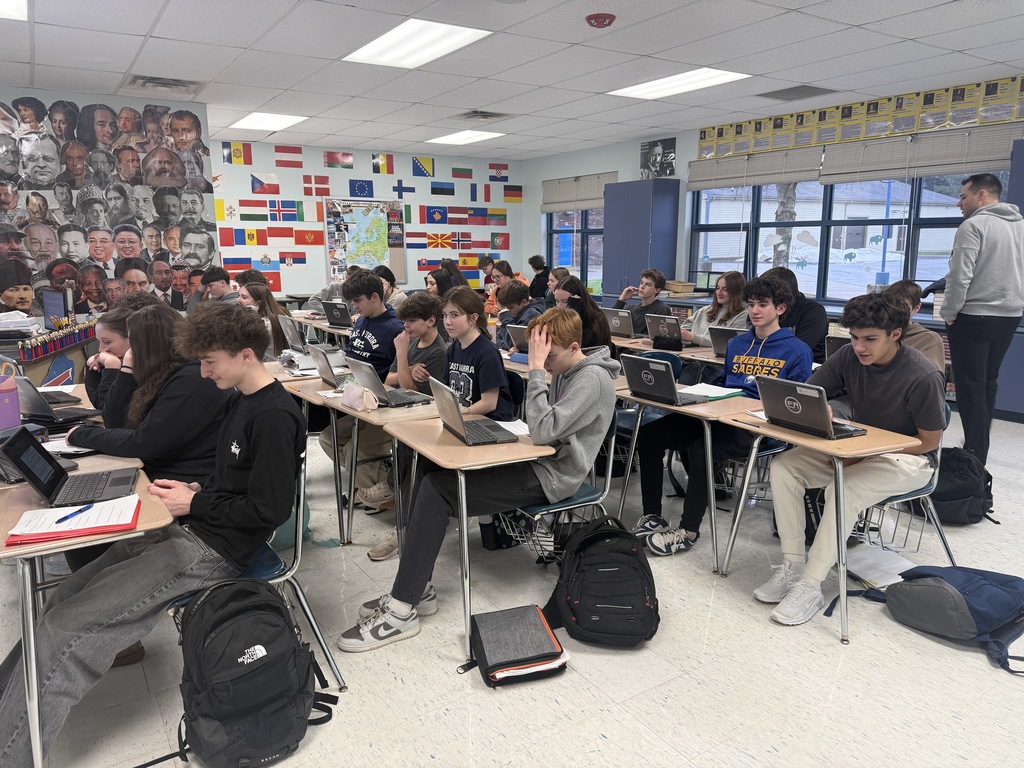 students smirking while reading the play
