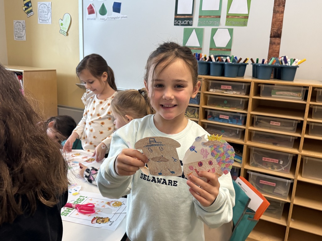 student showing off her coloring