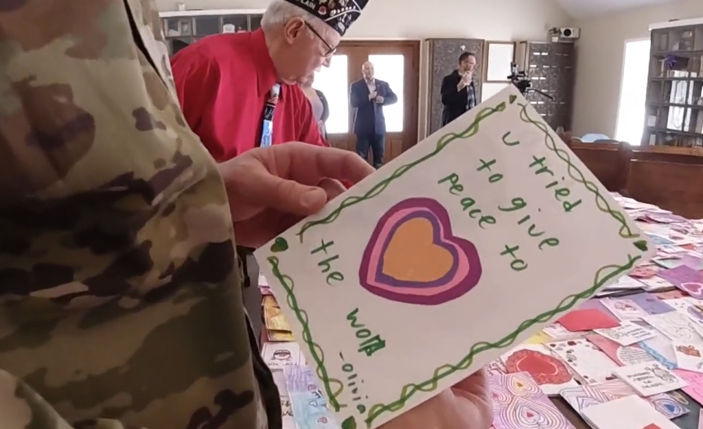 vet holding a valentines day card