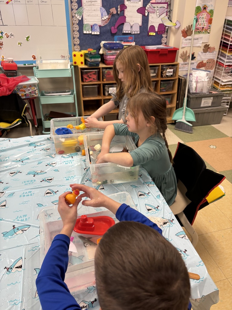 students playing with water tubs
