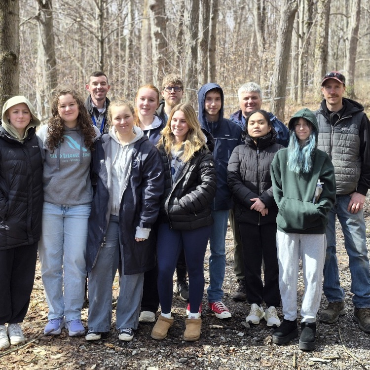 Eaat Aurora students on a science field trip in the woods