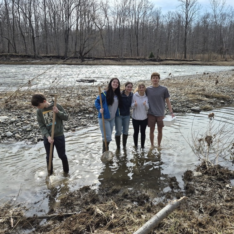 East Aurora students on a science club field trip cleaning the creek