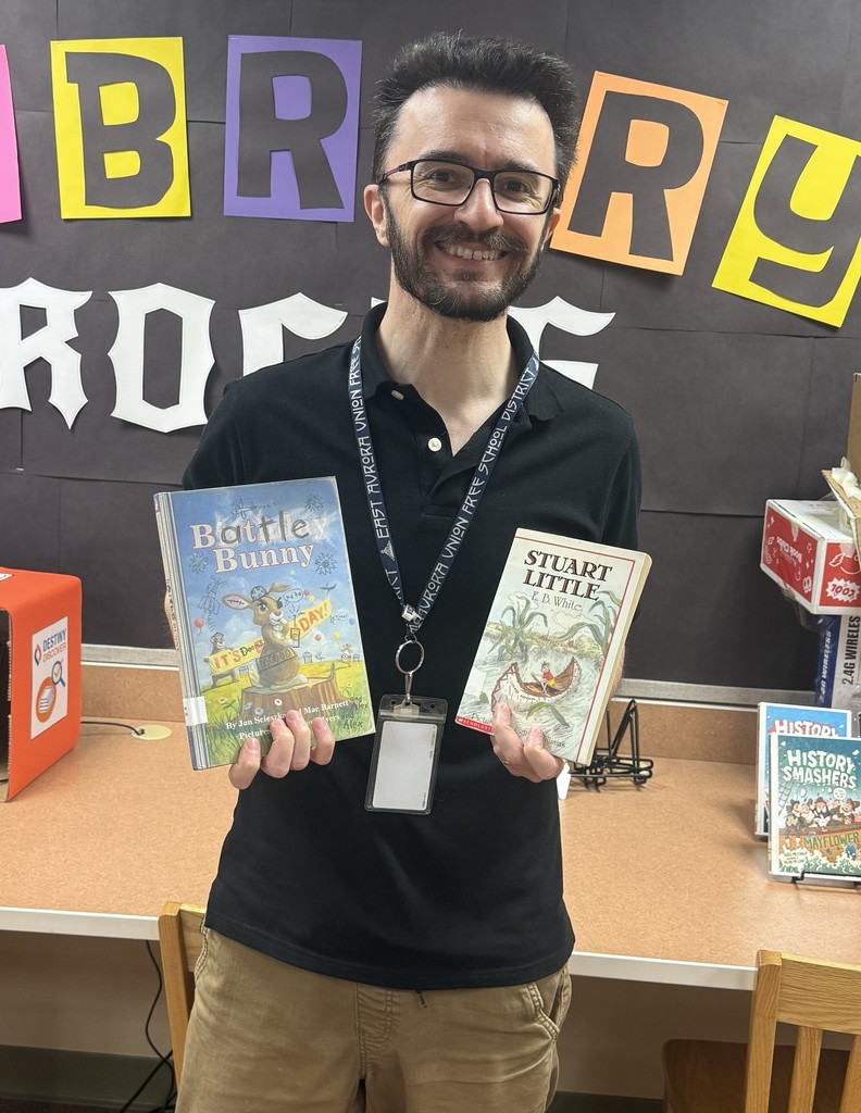 Mr. Duff holding his two book pics, Battle Bunny and Stuart Little
