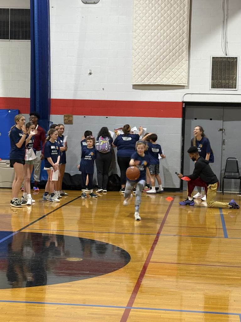 unified student dribbling the ball