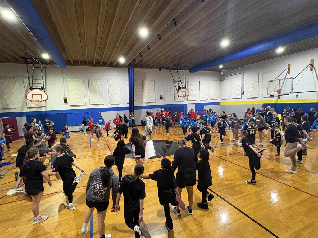 gym full of students stretching