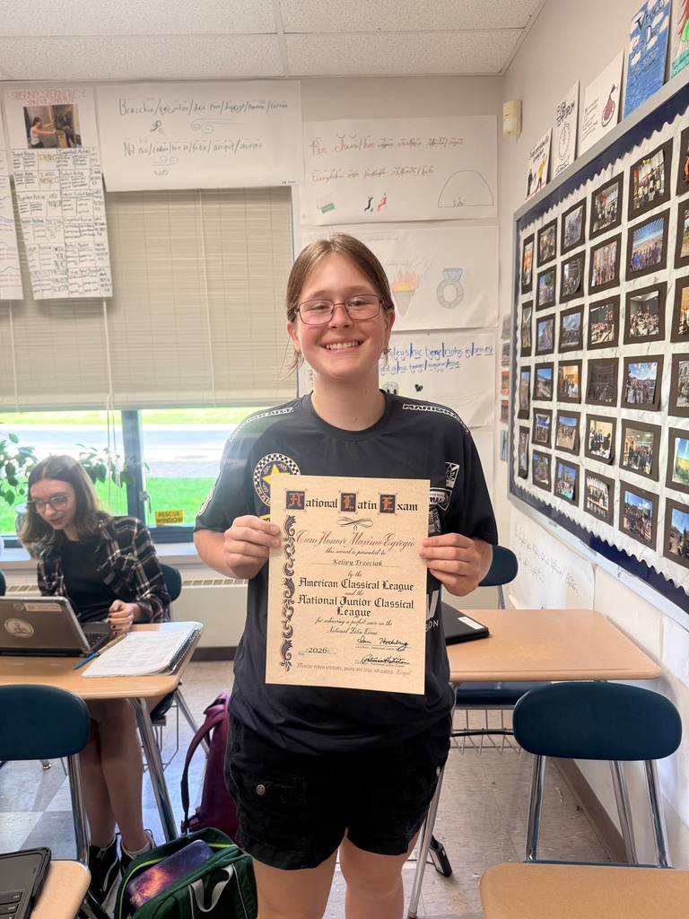 Kelsey smiling with her award